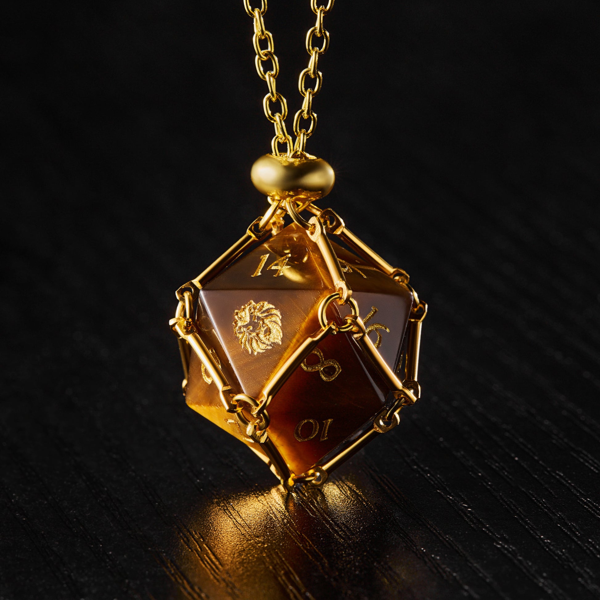 a golden necklace with a dice on it
