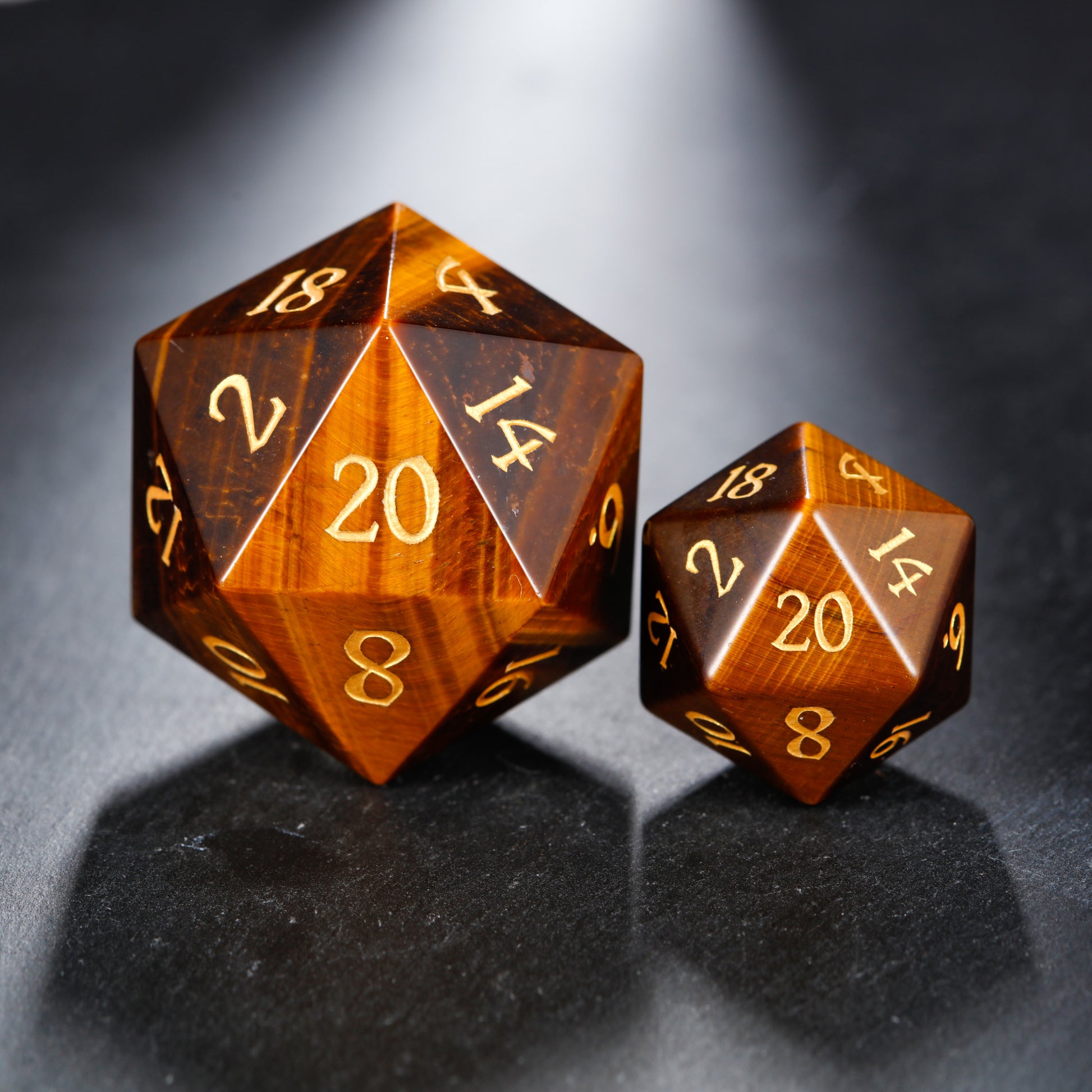 two brown dices sitting on top of a table