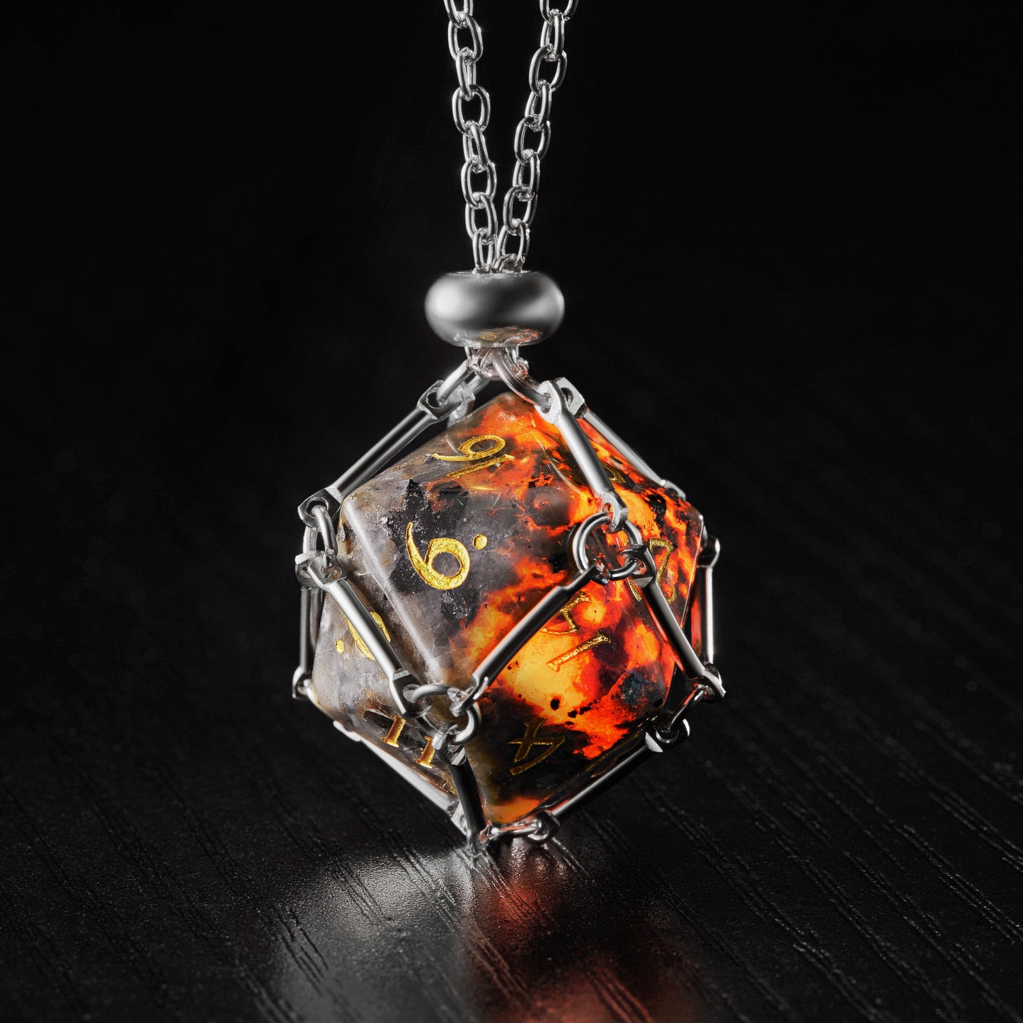 a necklace with a glass cube on a chain