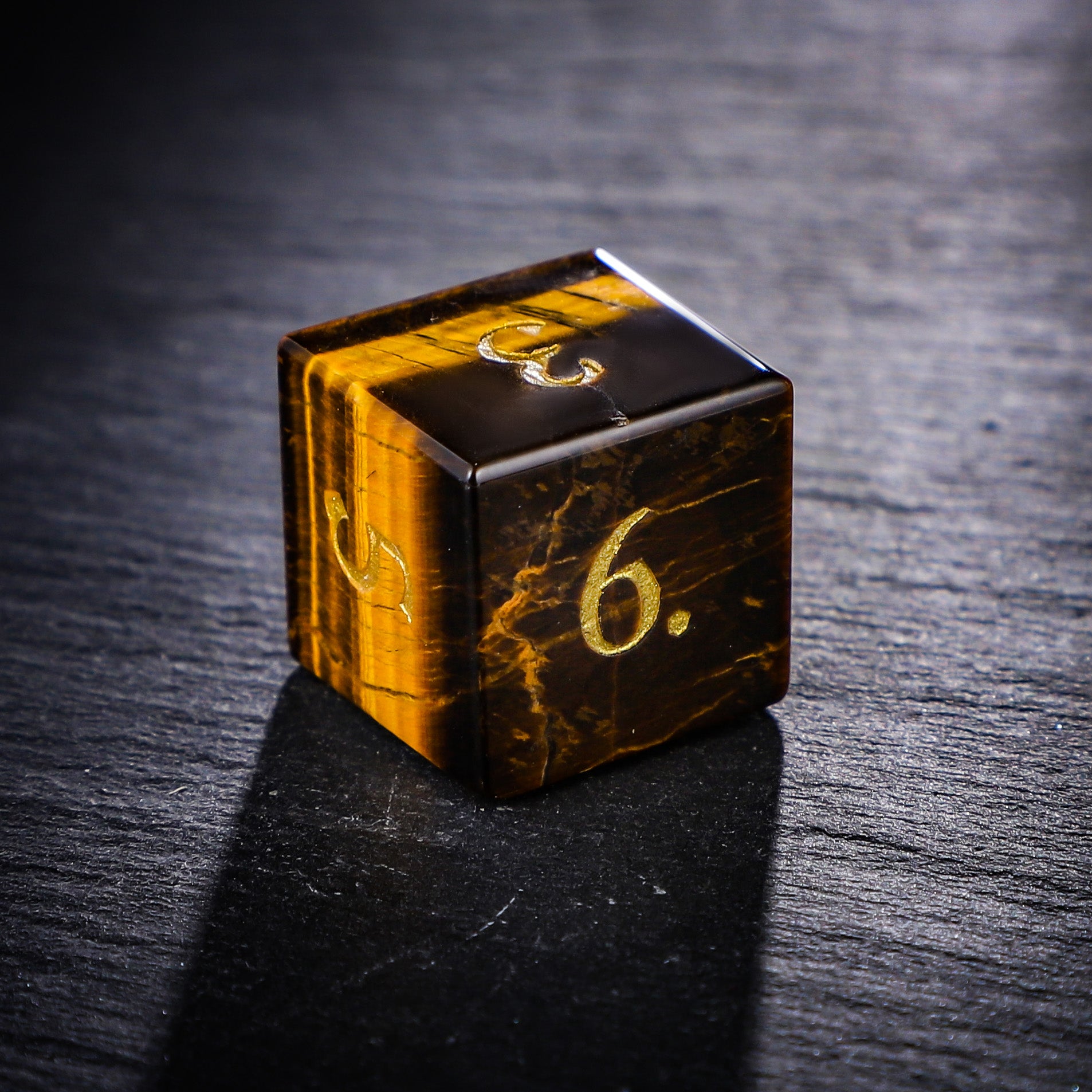 a wooden dice with numbers on it on a table