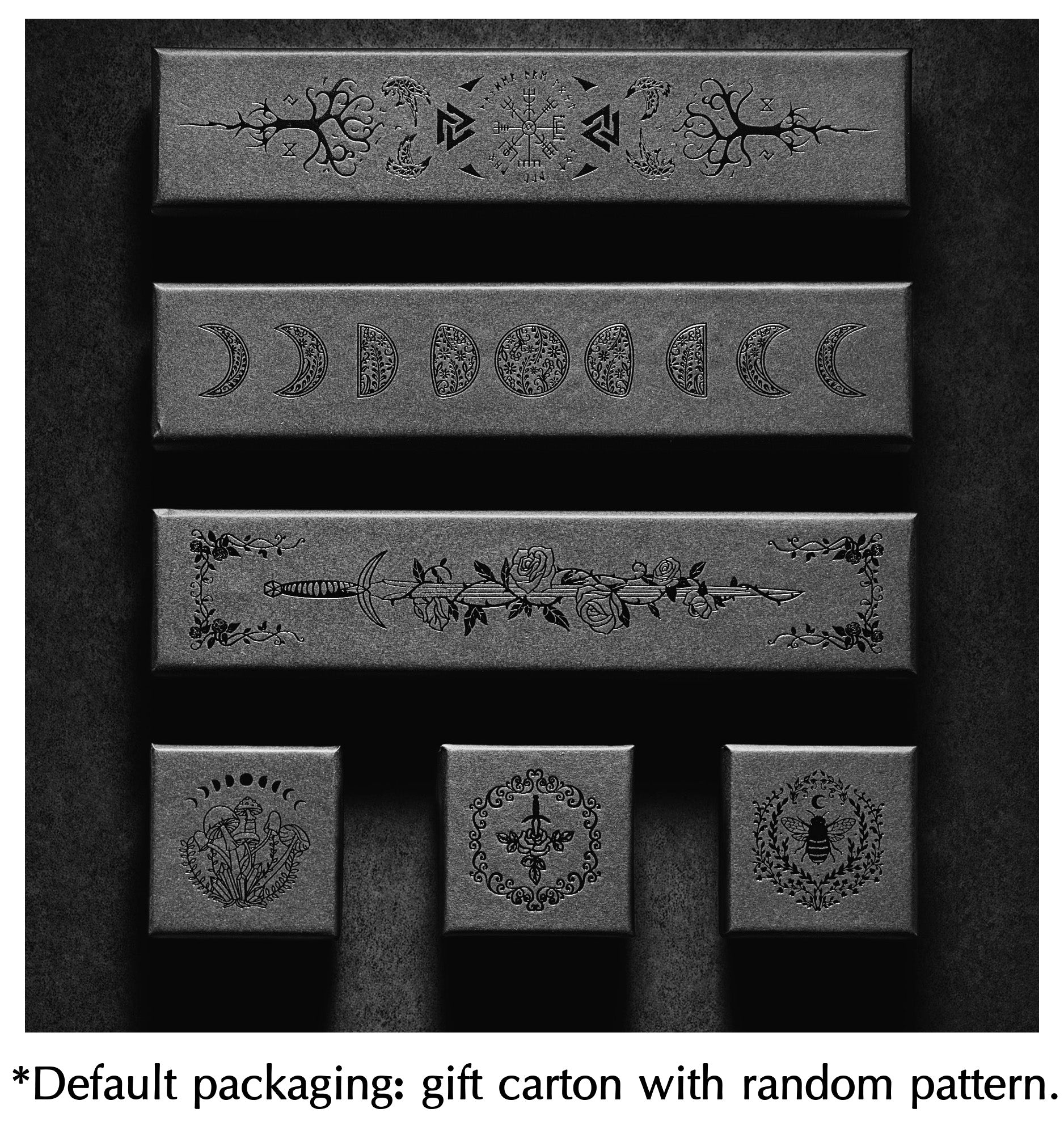 a black and white photo of four boxes with designs on them