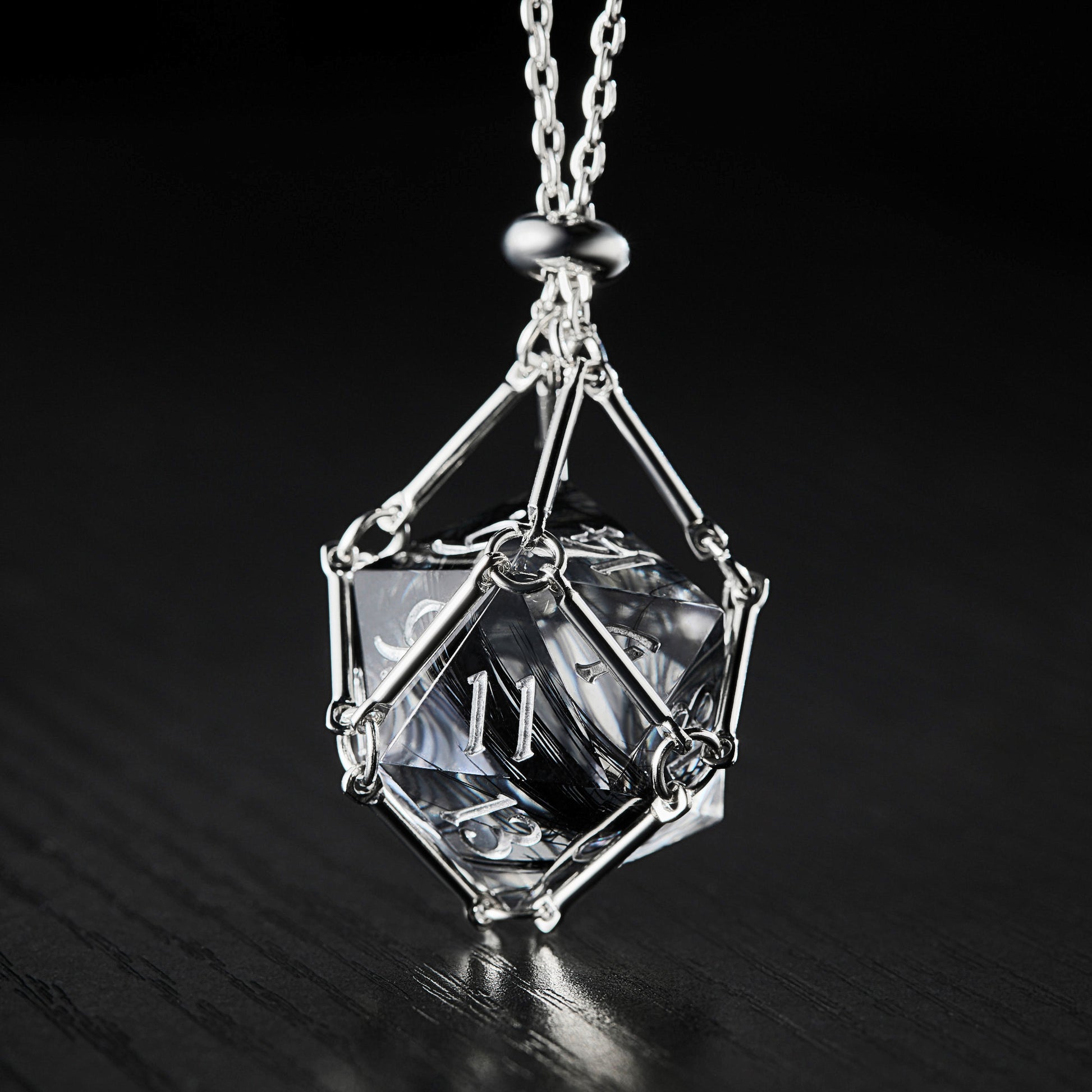 a necklace with a diamond on a chain