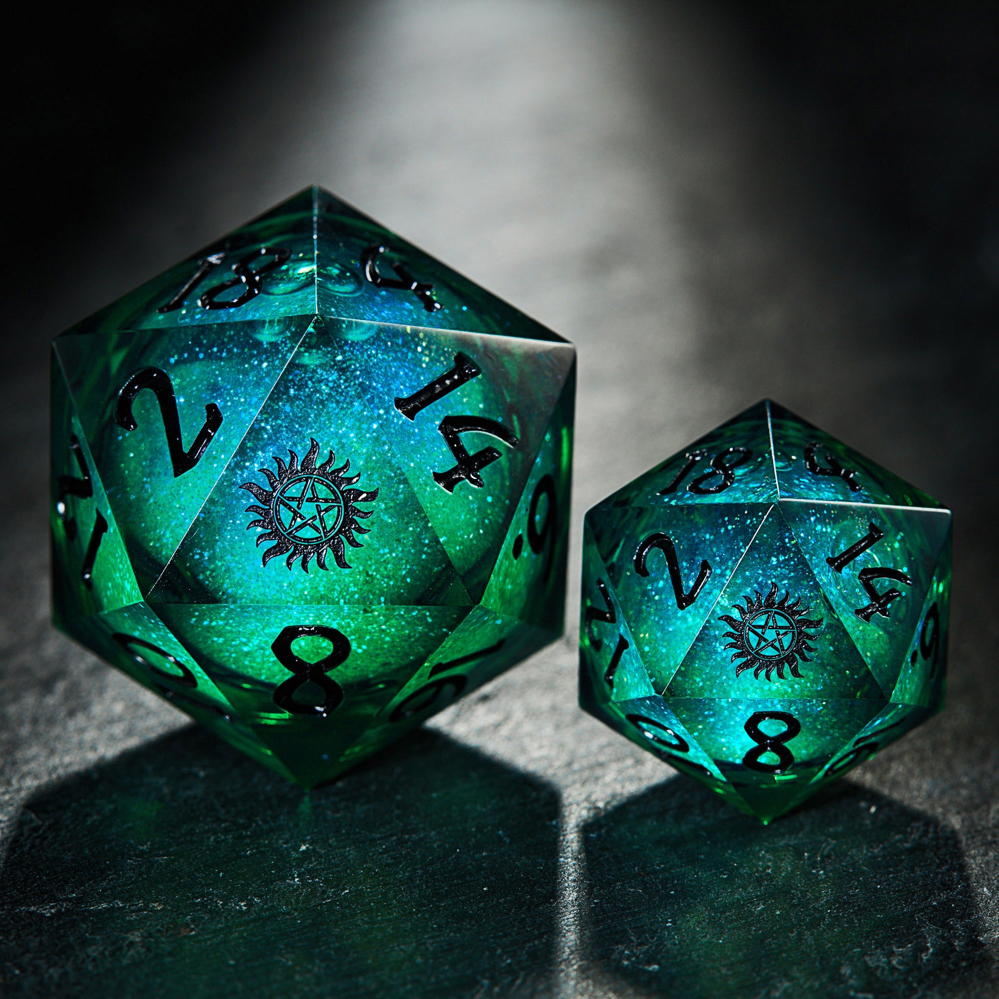 two green dices sitting on top of a table